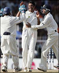 Kumble claims the wicket of Warne