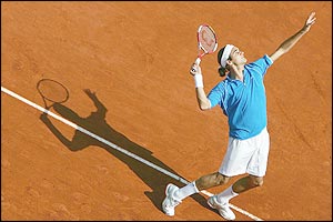 Roger Federer of Switzerland serves in his first round match against Kristof Vliegen of Belgium 