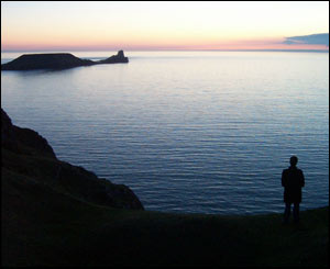 Keith Davies' daughter Leela in silhouette at Rhossilli during a visit home from Minnesota 