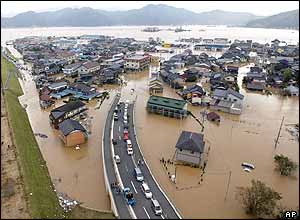Houses are seen submerged in water in Toyooka, western Japan Thursday, Oct. 21, 2004.