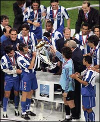 Costa and Baia hold the Champions League trophy aloft