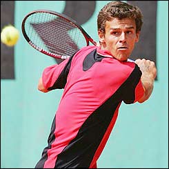 Gustavo Kuerten will face world number one Roger Federer after beating Gilles Elseneer 