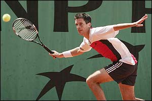 Henman plays a wide forehand