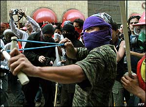 Rioter aims sling at police 