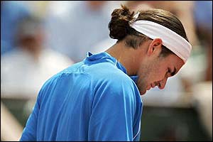 Roger Federer shows his disappointment after losing another point