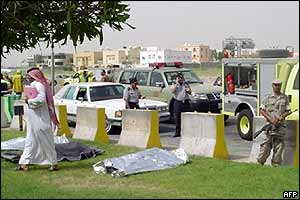 Covered bodies lie on grass verge in Khobar