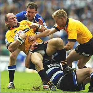 Lawrence Dallaglio is brought down by Michael Lipman and Chris Malone
