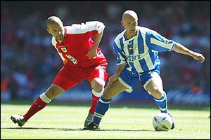 Charlie Oatway of Brighton battles with Christian Roberts of Bristol City