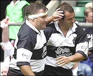 Jason Leonard celebrates his try with Thomas Castaignede