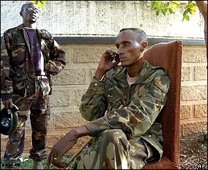 Laurent Nkunda talks on a mobile phone at the governor's residence in Bukavu
