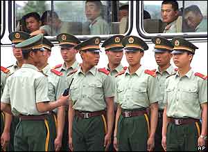 Chinese paramilitary police prepare to patrol in Beijing's Tiananmen Square, June 4, 2004 