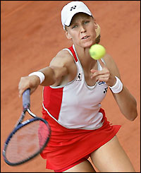 Elena Dementieva stretches to play a backhand