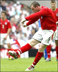 Wayne Rooney shoots to score his second goal