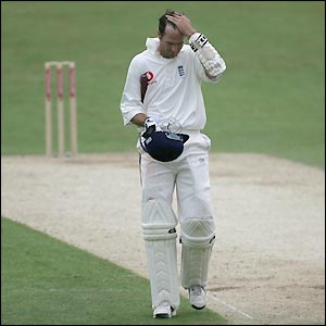 Michael Vaughan casts a lonely figure as he makes his way back to the pavilion
