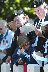 One young visitor is overcome as veterans look on 