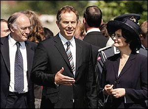 Conservative leader Michael Howard and Cherie Blair listen to the prime minister