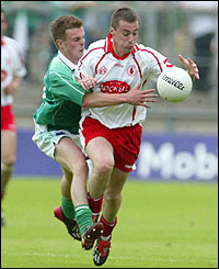 Fermanagh's Eamonn Maguire challenges Brian McGuigan at Clones