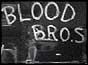 Blood brothers sign painted on shop window
