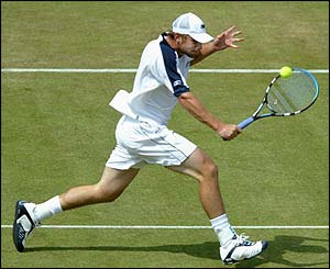 Andy Roddick plays a backhand return