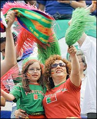 Fans of all ages enjoy the spectacle at the opening ceremony for Euro 2004