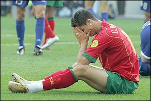 Ronaldo holds his head in his hands after conceding a penalty