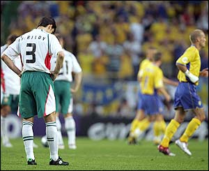 Bulgaria's players look dejected as Larsson scores his second goal