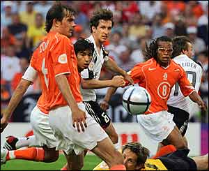 Dutch defenders watch the ball approach their goal from Torsten Frings' free-kick