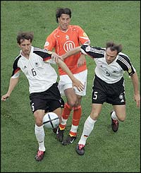 Rudd van Nistelrooy tries to find a way through the German defence