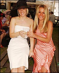Two ladies relax in a drinks tent