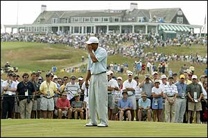 Tiger Woods reacts to missing a birdie opportunity