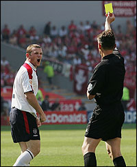 Wayne Rooney is booked for his foul on Swiss keeper Stiel
