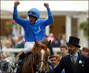 Frankie Dettori celebrates aboard Papineau