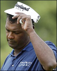 Vijay Singh reacts to a putt on the tenth green