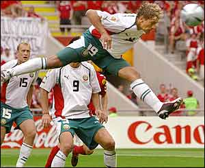 Bulgaria's midfielder Stilian Petrov heads the ball