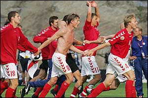 Danish players celebrate a 2-0 win that dumps Bulgaria out of the tournament,