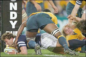 Scotland's Chris Cusiter forces himself over the line to score a try