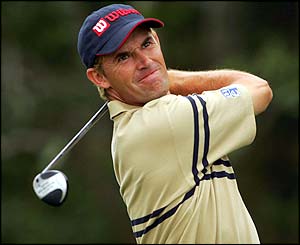 Padraig Harrington drives down the second