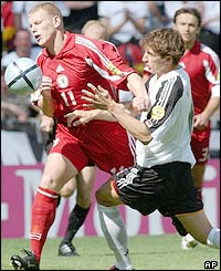 Latvia and Germany players tussle for the ball in the opening period