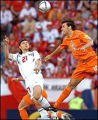 Czech Republic's midfielder Tomas Rosicky battles with Ruud van Nistelrooy