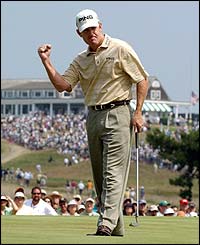 Jeff Maggert celebrates a birdie putt