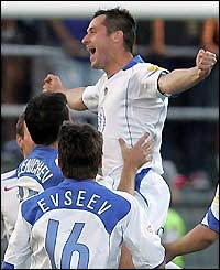 Russia's Dmitri Kirichenko celebrates opening the scoring