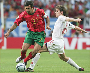 Xabi Alonso tackles Luis Figo