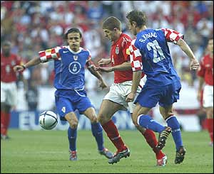 Steven Gerrard goes past Croatia's Robert Kovac