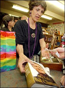 Starr Mitchell picks up her copy of the book just after midnight at Wordsworth Books in Little Rock