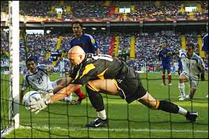 Costas Katsouranis' shot is saved by Fabien Barthez 