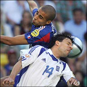 David Trezeguet and Panagiotis Fyssas battle for the ball