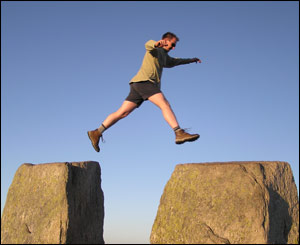 Robert Ansell jumping from Eve to Adam at the top of Tryfan