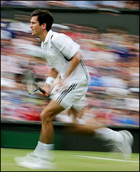 Tim Henman runs to the net 