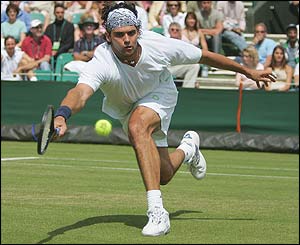 Mark Philippoussis stretches for a shot