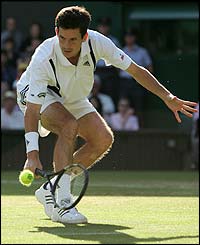 Tim Henman plays a deft volley at the net